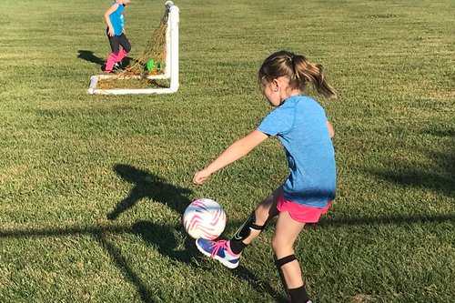 girls kicks soccer ball platte county sports